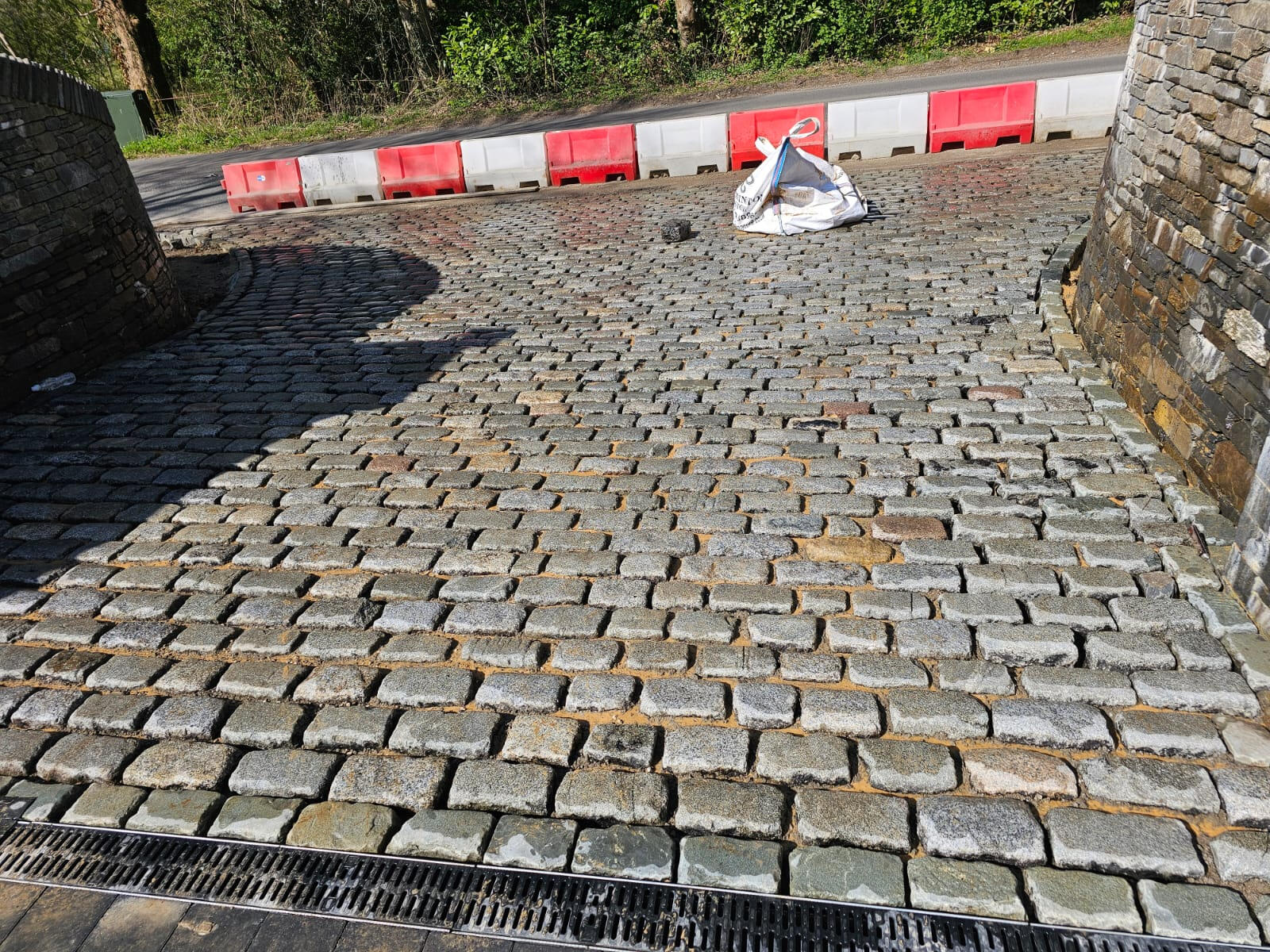 Reclaimed granite sett driveway with linear drainage channel