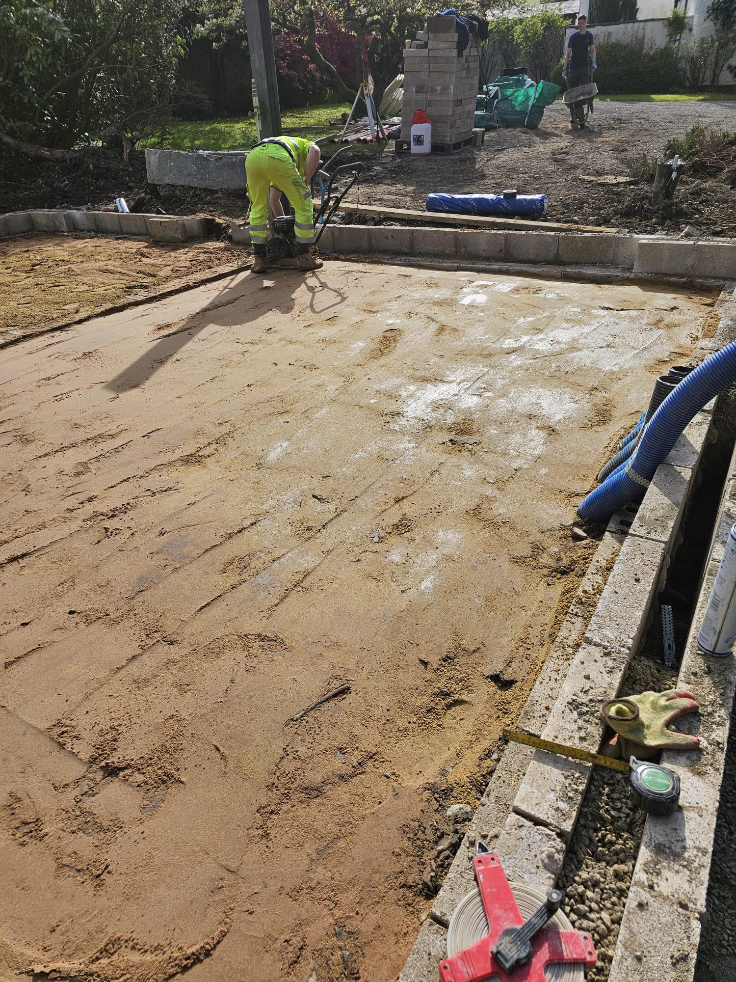 Compacted sharp sand bedding for block paving driveway
