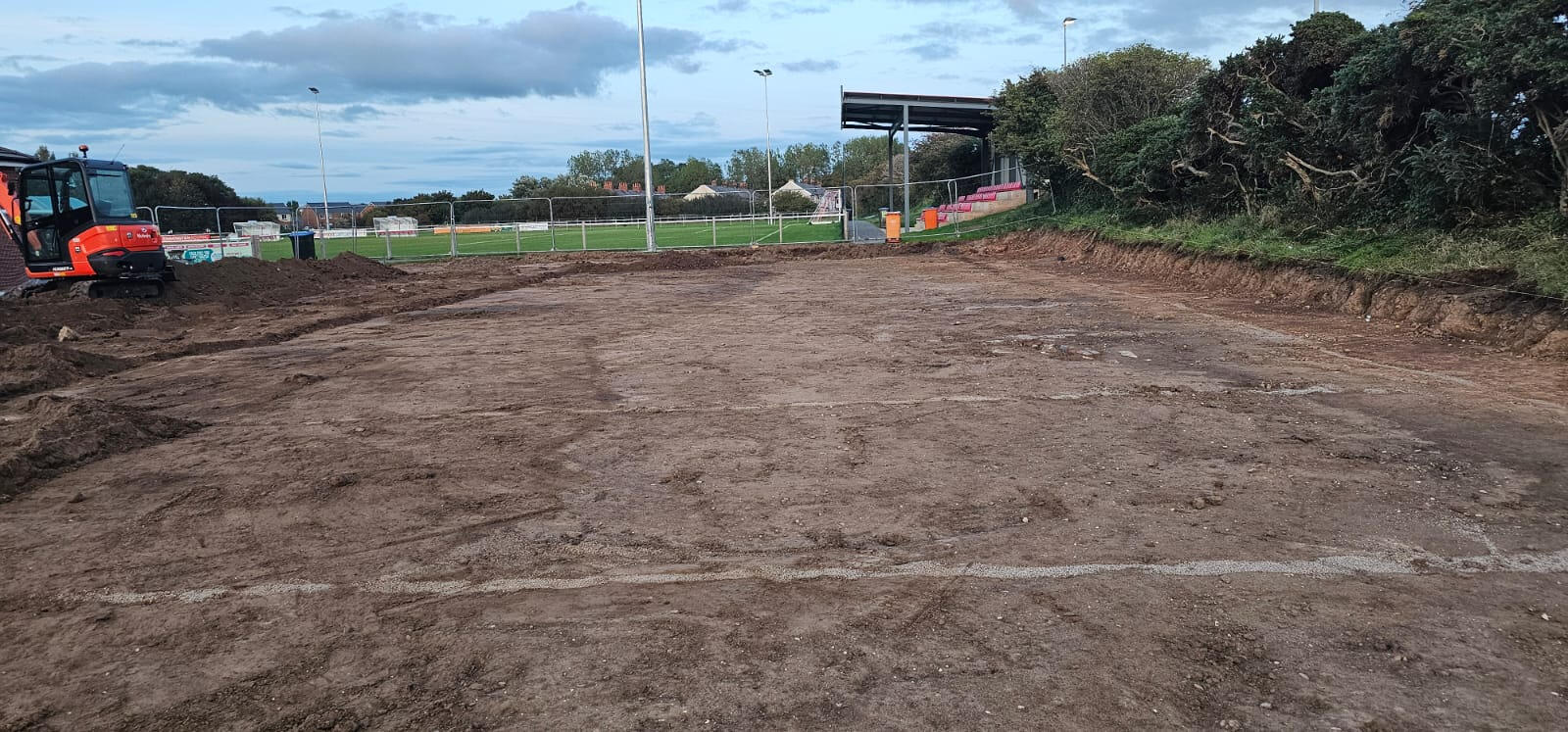 Site after initial dig and bulk muck-away alongside the football pitch