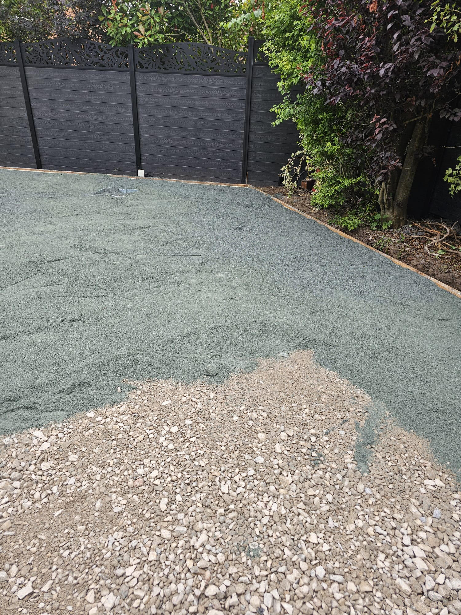 Screeded green sharp-sand layer over compacted sub-base ready for astroturf rolls