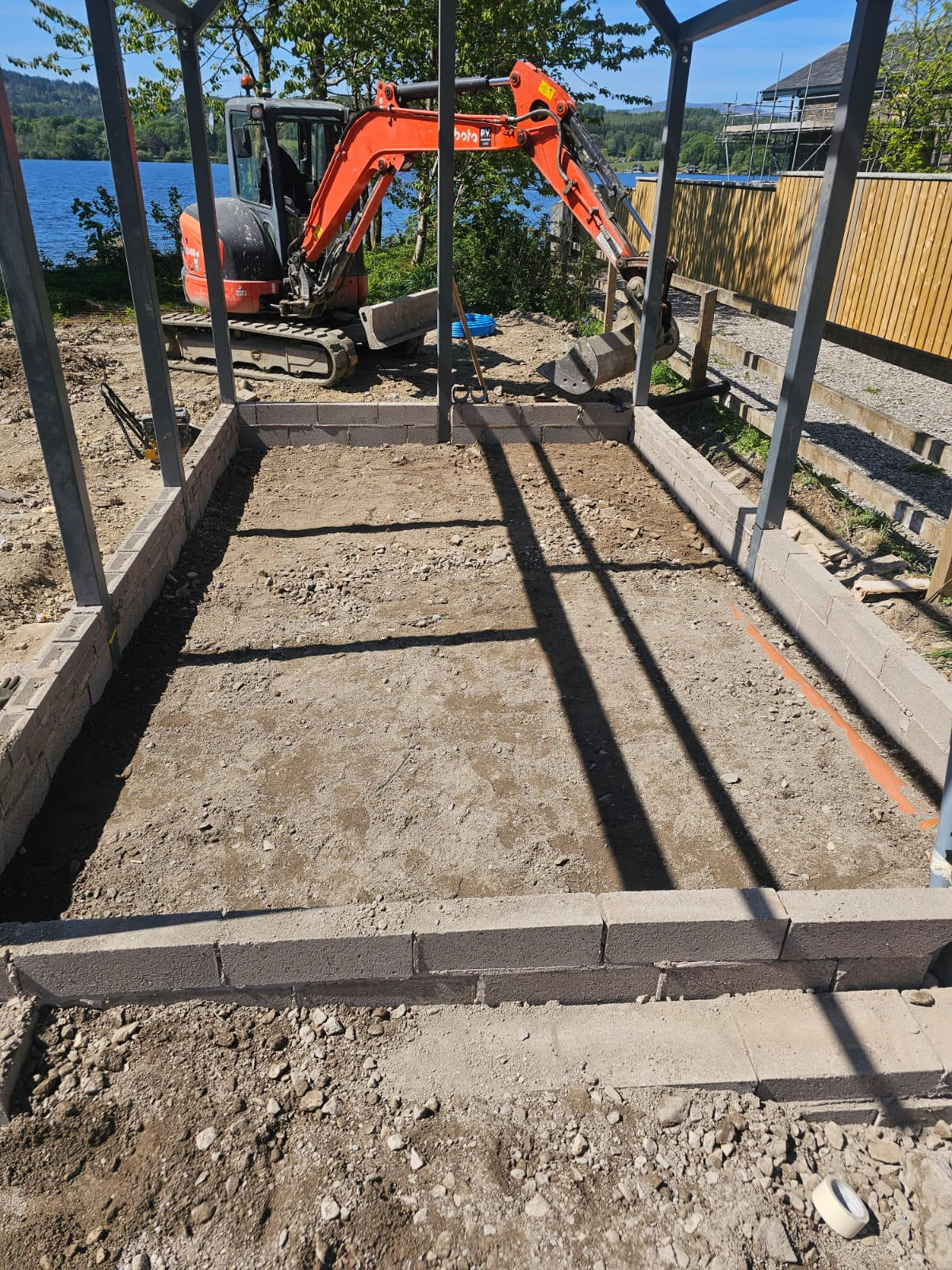 Blockwork foundation walls built up to DPC level inside the steel-frame building