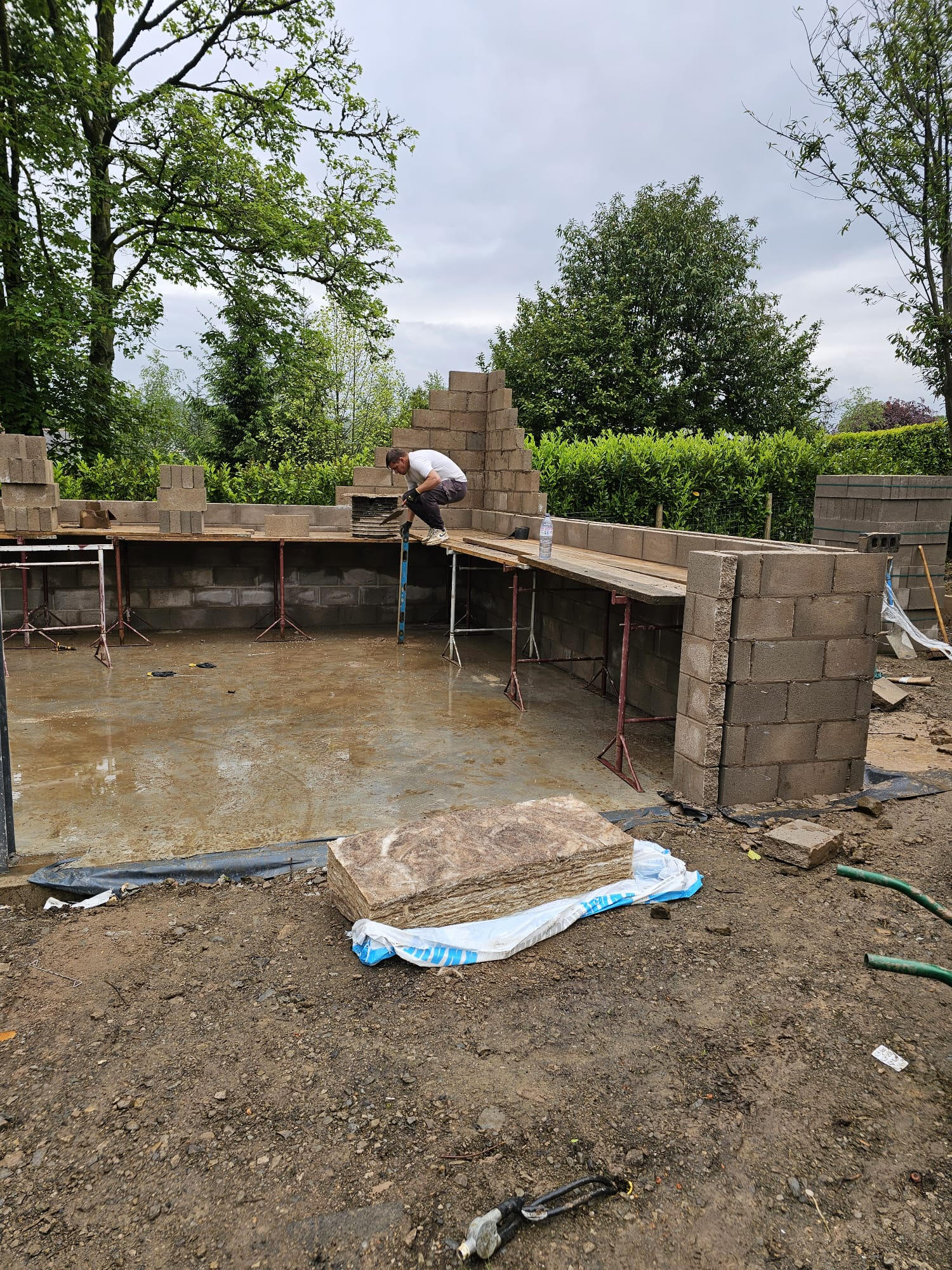 Block-and-beam foundation walls being built on a new build